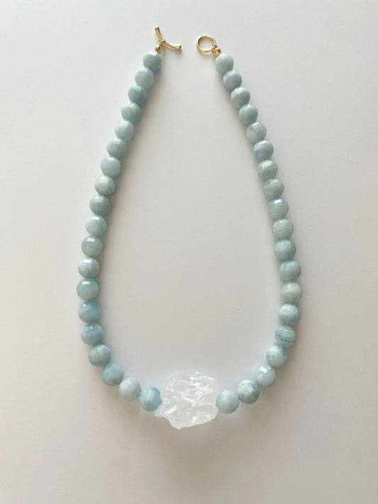 Necklace with light blue Aquamarine beads on a white background